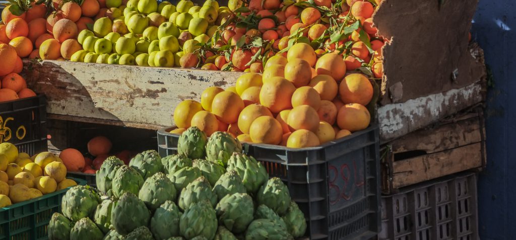 Variety of fresh fruits and vegetables for sale in the local mar