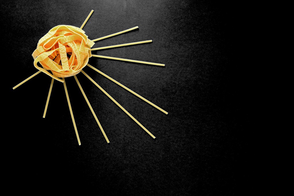 The Sun Of Pasta, Spaghetti And Fettuccine On A Blue Background,